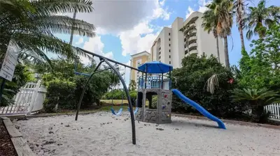 a playground with a slide in the sand at 3704 Relax Unwind 2-BD 2-BA Resort Condo in Orlando