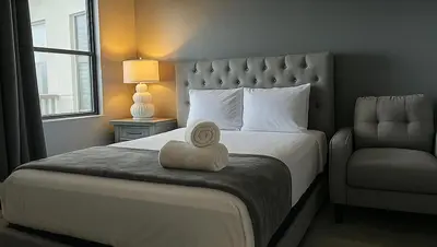 a bedroom with a bed with a hat on it at 3704 Relax Unwind 2-BD 2-BA Resort Condo in Orlando