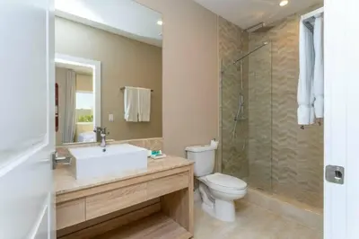 a bathroom with a sink and a toilet and a shower at Modern 4bed townhome in the heart of Kissimmee in Orlando