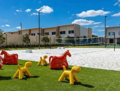 a group of plastic toy animals on the grass at Modern 4bed townhome in the heart of Kissimmee in Orlando