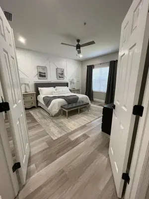 a bedroom with a bed and a ceiling fan at Gated 3BR 3BA Townhome Near Disney w Pool and Gym in Orlando