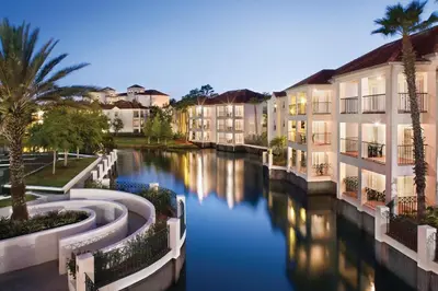 aiety of apartment buildings on a river in a city at Wyndham Star Island Resort 2BR Apartment with Resort Access in Kissimmee