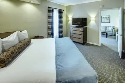 a hotel room with a bed and a television at Wyndham Star Island Resort 3BR Apartment with Resort Access in Kissimmee