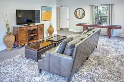 a living room with a couch and a television at Wyndham Cypress Palms 2BR Apartment with Resort Access in Kissimmee