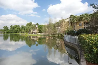 a view of a river with buildings and trees at Wyndham Cypress Palms 2BR Apartment with Resort Access in Kissimmee