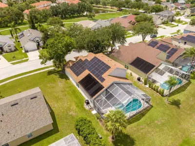 an overhead view of a house with solar panels on it at Amazing 6 bedrooms with pool in Kissimmee