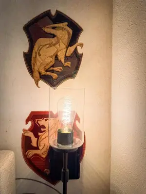 a lamp with a picture of a lion on a wall at Harry Potter Suite near Epic & Universal in Orlando