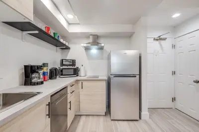 a kitchen with a stainless steel refrigerator at Harry Potter Suite near Epic & Universal in Orlando
