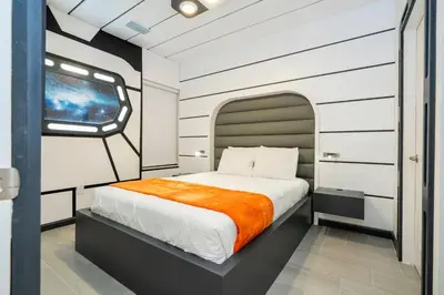 a bedroom with a bed and a tv in it at Paradiso Grande 6 bedroom New Home - 10377 in Orlando