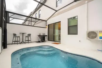 a swimming pool in the middle of a building at Paradiso Grande 6 bedroom New Home - 10377 in Orlando