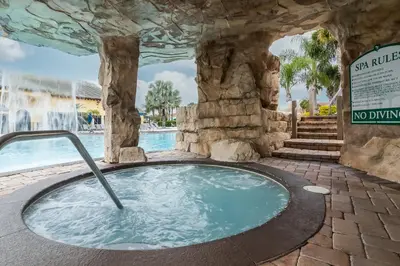 a hot tub in a pool at a resort at Adventurers Oasis - Private pool in Kissimmee