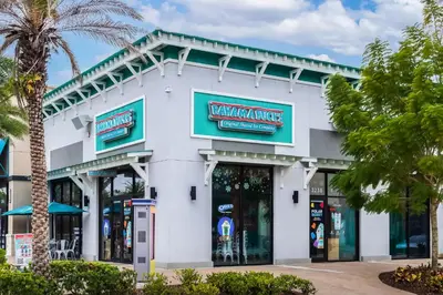 a white building with a walmart sign on it at Shake Shack - Heated Pool-NO Fee & Hot Tub in Orlando