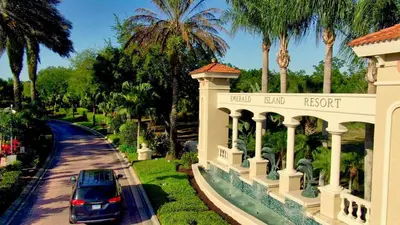a car parked in front of a house at Emerald Island Happy Place in Kissimmee