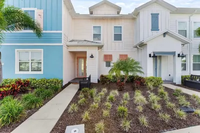 a house with a blue and white at Flamingo Paradise in Orlando