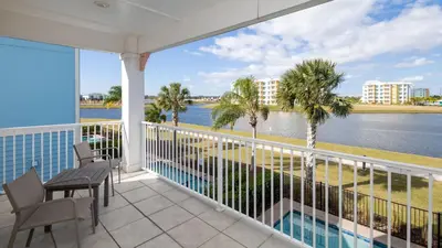 a balcony with a view of the water at Formosa Mimosa - Margaritaville in Orlando