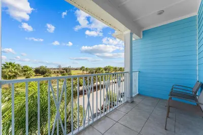 a view from the balcony of a blue house at Frankly Fintastic - Happy Days in Orlando