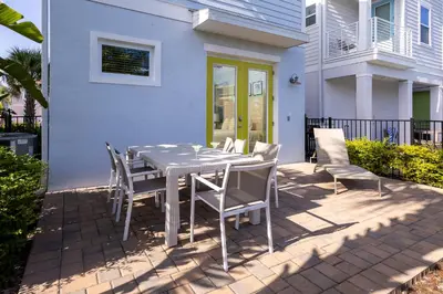 a table and chairs on a patio in front of a house at Up to Scale With Margaritas in Orlando