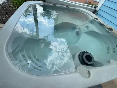 a jacuzzi tub with water pouring into it at Get Happy in Orlando