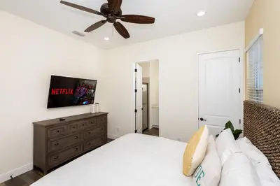 a bedroom with a bed and a ceiling fan at Hunky Dory II in Orlando