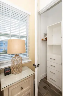 a lamp on a dresser in a room with a window at Hunky Dory II in Orlando