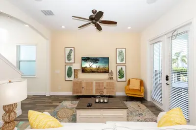 a living room with a ceiling fan and a couch at Hunky Dory II in Orlando