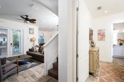 a living room with a staircase and a couch at Trade Winds Life - Margaritaville in Orlando
