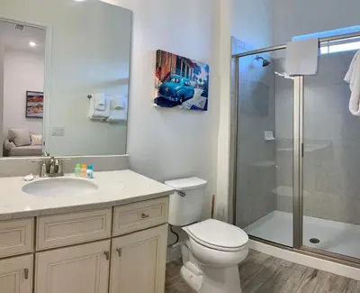 a bathroom with a shower and a toilet and a sink at Krows Nest - Near Disney World & Universal in Orlando