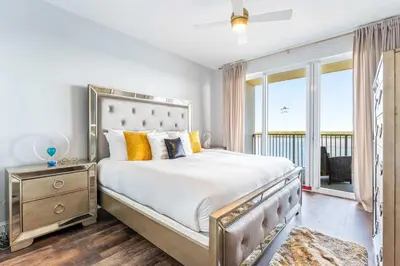 a bedroom with a large bed and a window at Lake Views At Blue Heron in Orlando