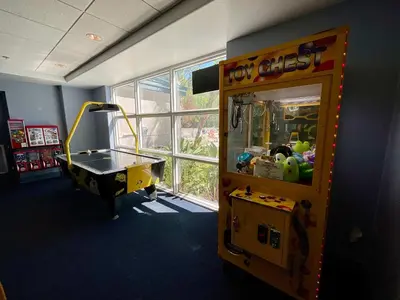 a play room with a toy chest and a table at Lake Views At Blue Heron in Orlando