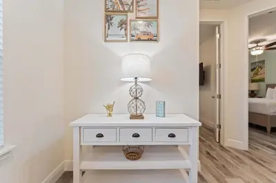 a white table with a lamp on top of it at Mint to Be in Orlando