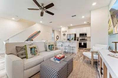 a living room with a couch and a table at Mint to Be in Orlando