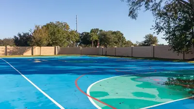 a blue basketball court with a hose on it at Moana's Hut - Miles from World's Best Theme Parks in Kissimmee