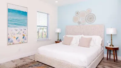 a white bedroom with a white bed and a window at No Way Rose - Nearby Disney World & Universal in Orlando