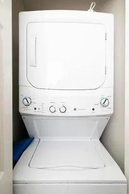 a white microwave oven sitting on top of a dishwasher at Orlando's Heartland with Amenities in Kissimmee