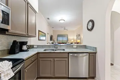 a kitchen with a sink and a counter top at Peaceful Horizons at Caribe Cove in Kissimmee