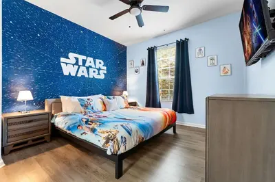 a bedroom with a star wars mural on the wall at Windsor Hills Resort 2Bd with Great Amenities in Orlando