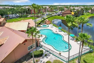 an aerial view of a swimming pool at a resort at Playing Hooky in Kissimmee