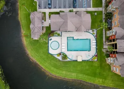 an aerial view of a building with a swimming pool at Playing Hooky in Kissimmee