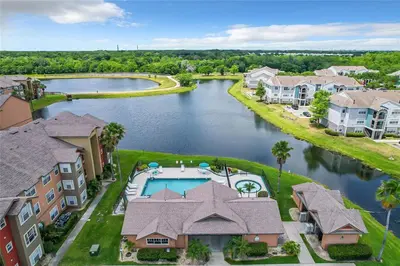 an aerial view of a resort property with a lake at Playing Hooky in Kissimmee