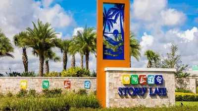 a sign at a resort with palm trees in the background at Sun & Fun Storey Lake in Kissimmee