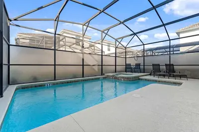 an indoor swimming pool with a glass roof at Sun & Fun Storey Lake in Kissimmee