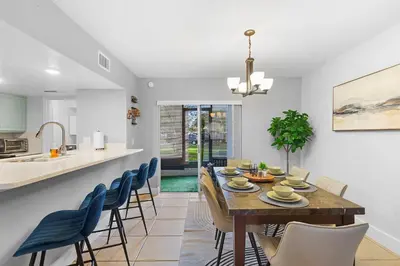 a dining room and kitchen with a table and chairs at Enjoy your Summer Near to Disney- Universal-Epic in Kissimmee