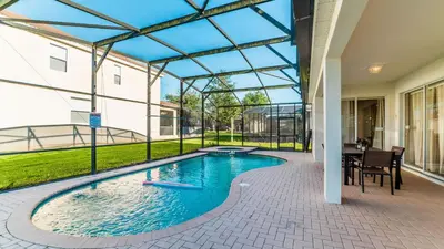 a swimming pool in a building with a glass roof at Disney Retreat w/ Wizard & Galaxy Rooms in Orlando