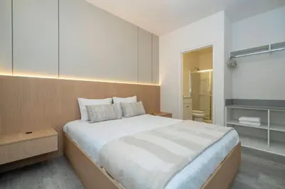 a bedroom with a large bed and a television at Paradiso Grande 5 Bed New Townhome - 10329 in Orlando