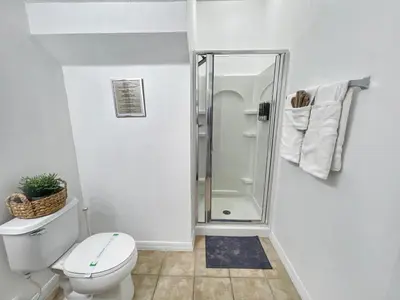 a bathroom with a shower and a toilet at Rumi Haven-Homey&Spacious Stay in Orlando