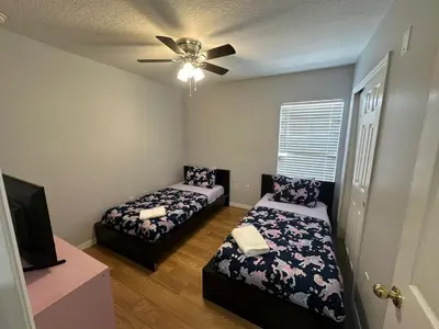 a bedroom with two beds and a ceiling fan at SHVPC3 - Paradise Cay #3 - 3 Bed 2.5 Baths Townhome in Kissimmee
