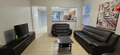 a living room with a couch and two chairs at SHVPC3 - Paradise Cay #3 - 3 Bed 2.5 Baths Townhome in Kissimmee