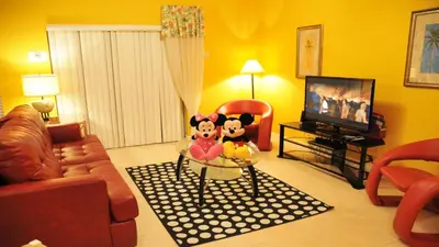two stuffed animals sitting on a table in a living room at SHVCK1 - Coral Cay Resort #1 - 4 Bedroom Townhouse in Kissimmee