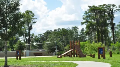 a playground in a park with a slide at SHVCK3 - Coral Cay Resort #3 - 4 Bed 3 Baths Townhome in Kissimmee