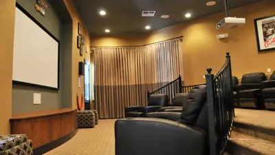 a movie room with chairs and a screen at SHVCK3 - Coral Cay Resort #3 - 4 Bed 3 Baths Townhome in Kissimmee